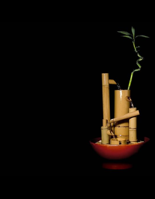 Image with small bamboo water fountain handmade from natural bamboo